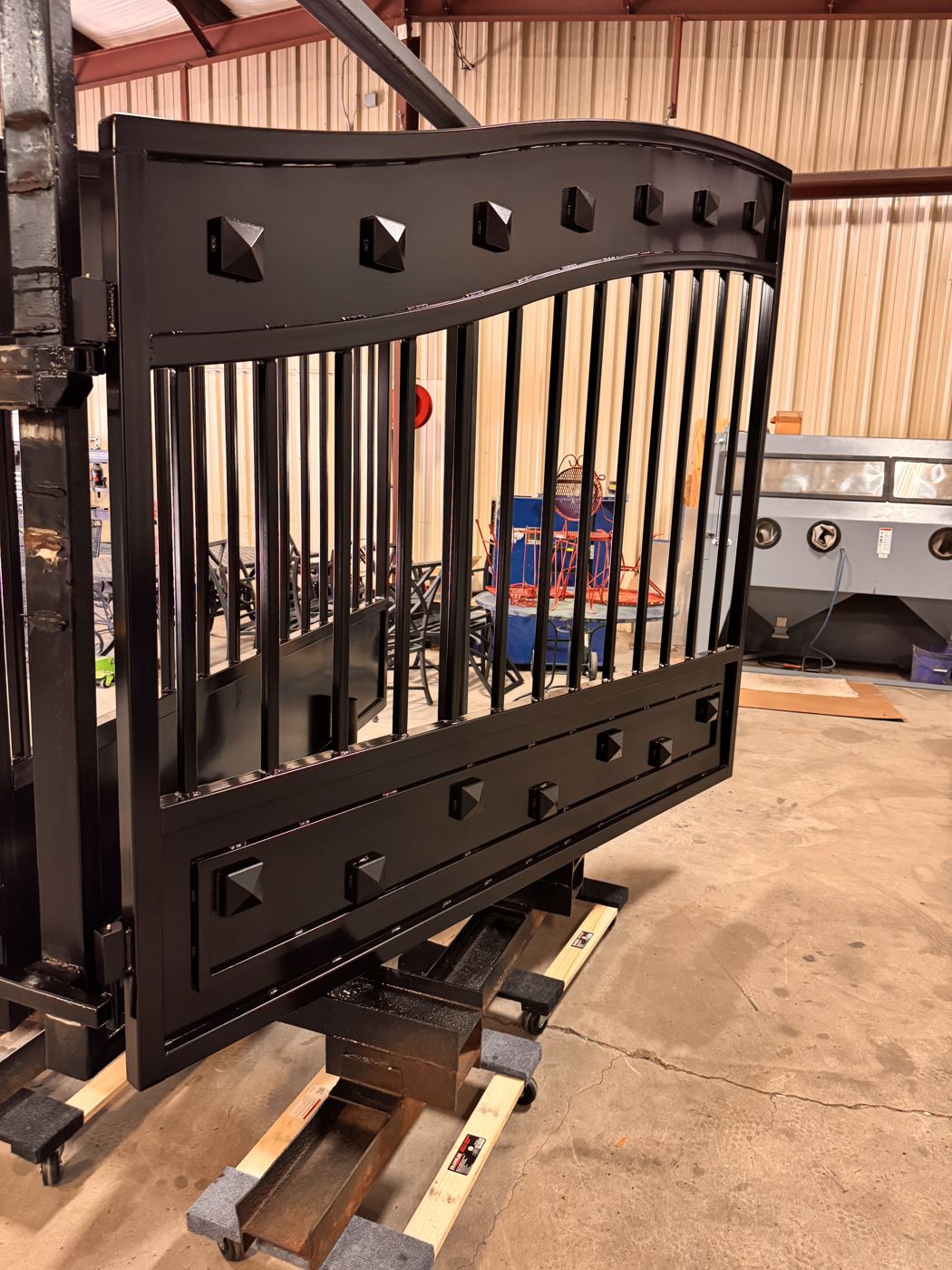 Black powder coated decorative iron gate in the shop